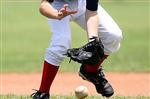 Baseball player catching a ground ball